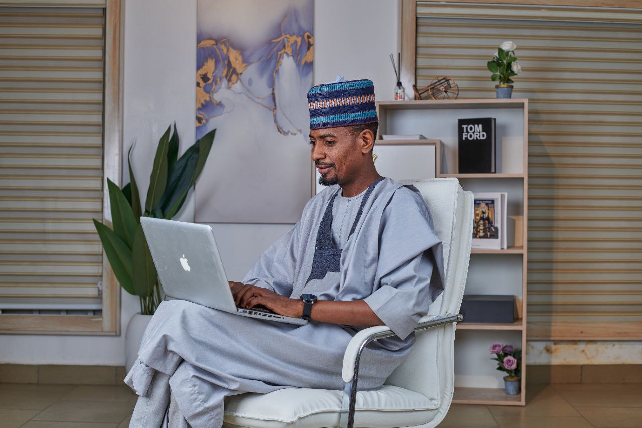 Man with laptop in chair